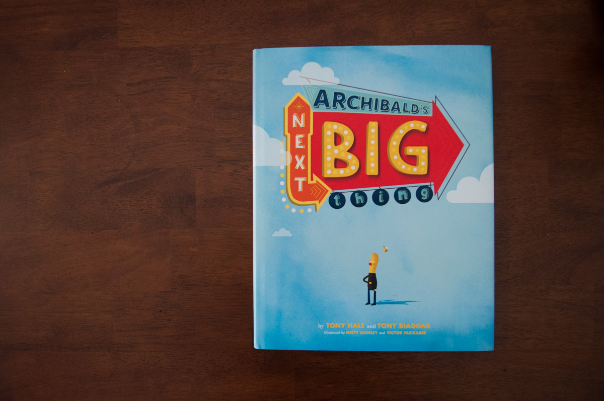 Archibald's Next Big Thing children's book on a wooden table
